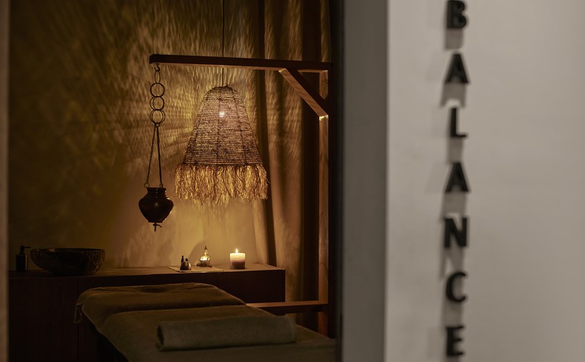 Casa Cook Rhodes Spa looking into a treatment room with candles and dim lighting for relaxation