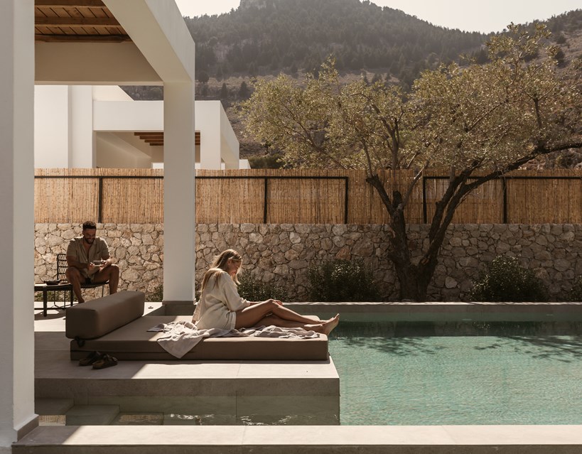 Casa Cook Rhodes Premium Villa with Private Pool with guests enjoying the lounger and pool views of their room